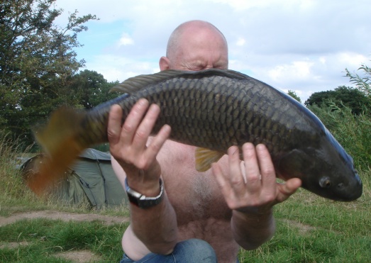 Carp jumps out of hands and lands safely on an unhooking mat!
