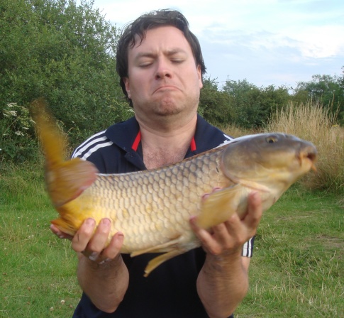 common carp fishing. Common carp flips out of my