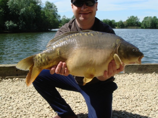 A mid-double figured nirror carp from Oxford waters caught on weed rigs
