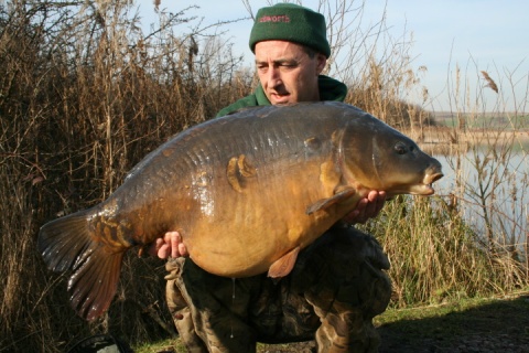 Martin Clarke with a huge 40 pound plus mirror carp caught off the top