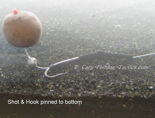 illustrates how weight pulls pop-up down into silt